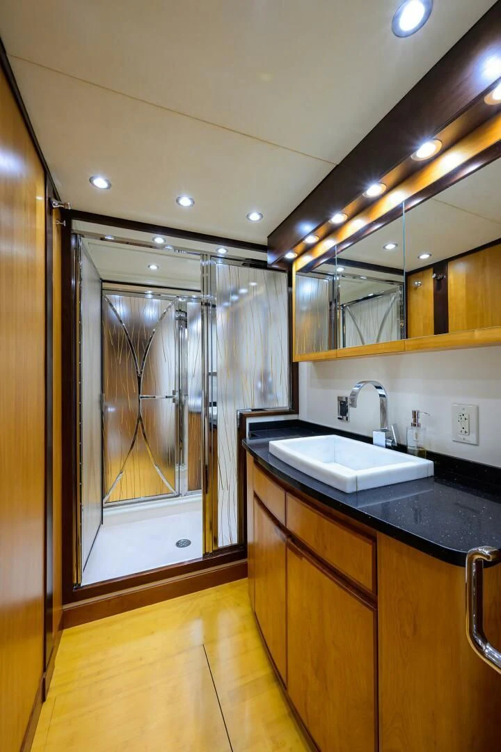 a bathroom with a large mirror aboard ELECTRA Yacht for Sale