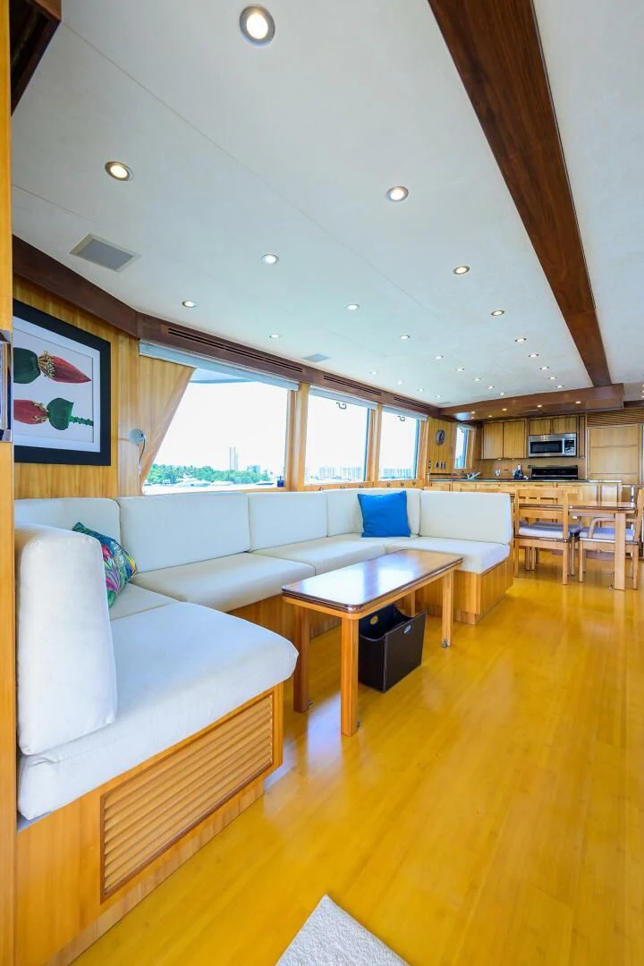 a living room with a couch and a table aboard ELECTRA Yacht for Sale