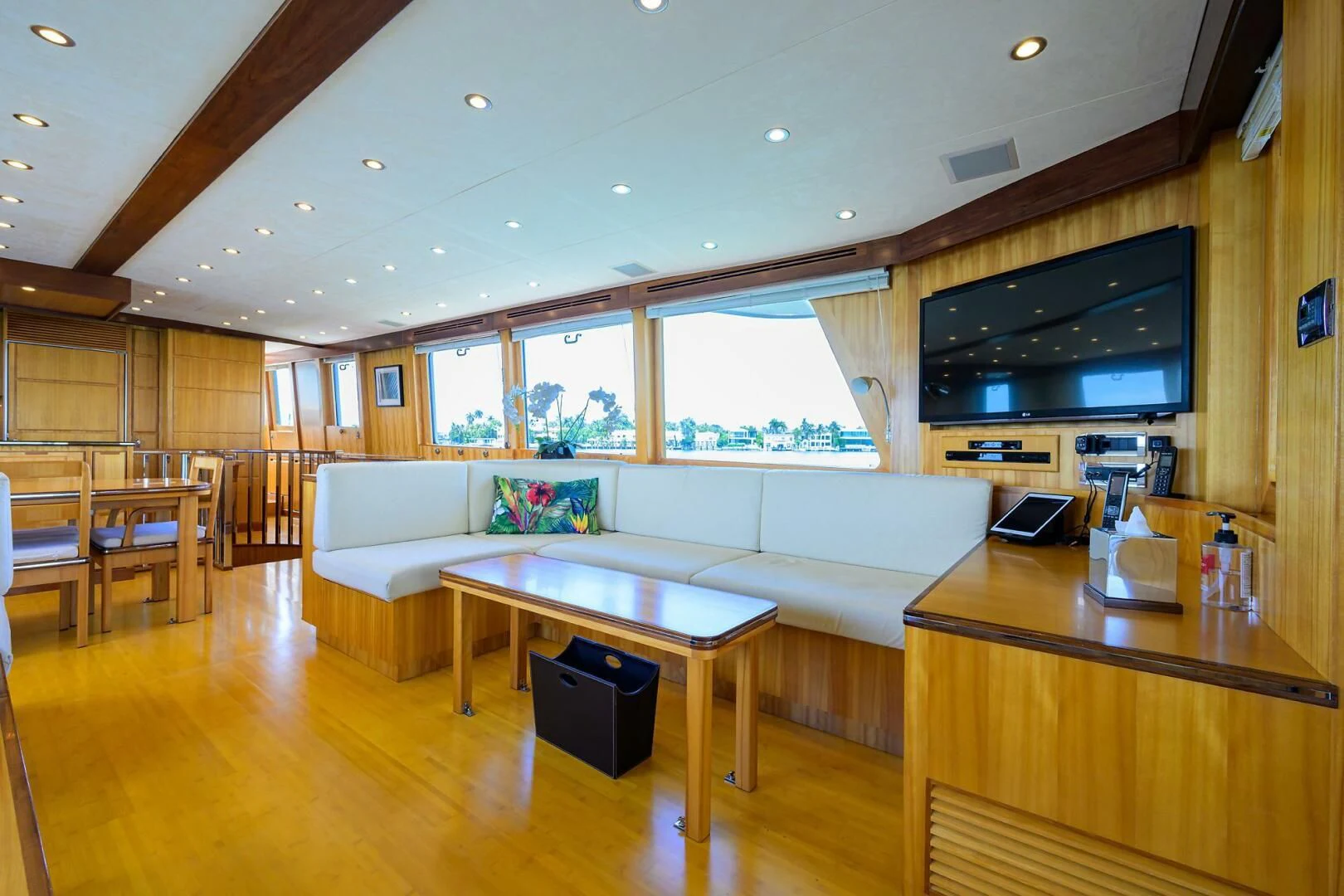 a living room with a large television aboard ELECTRA Yacht for Sale