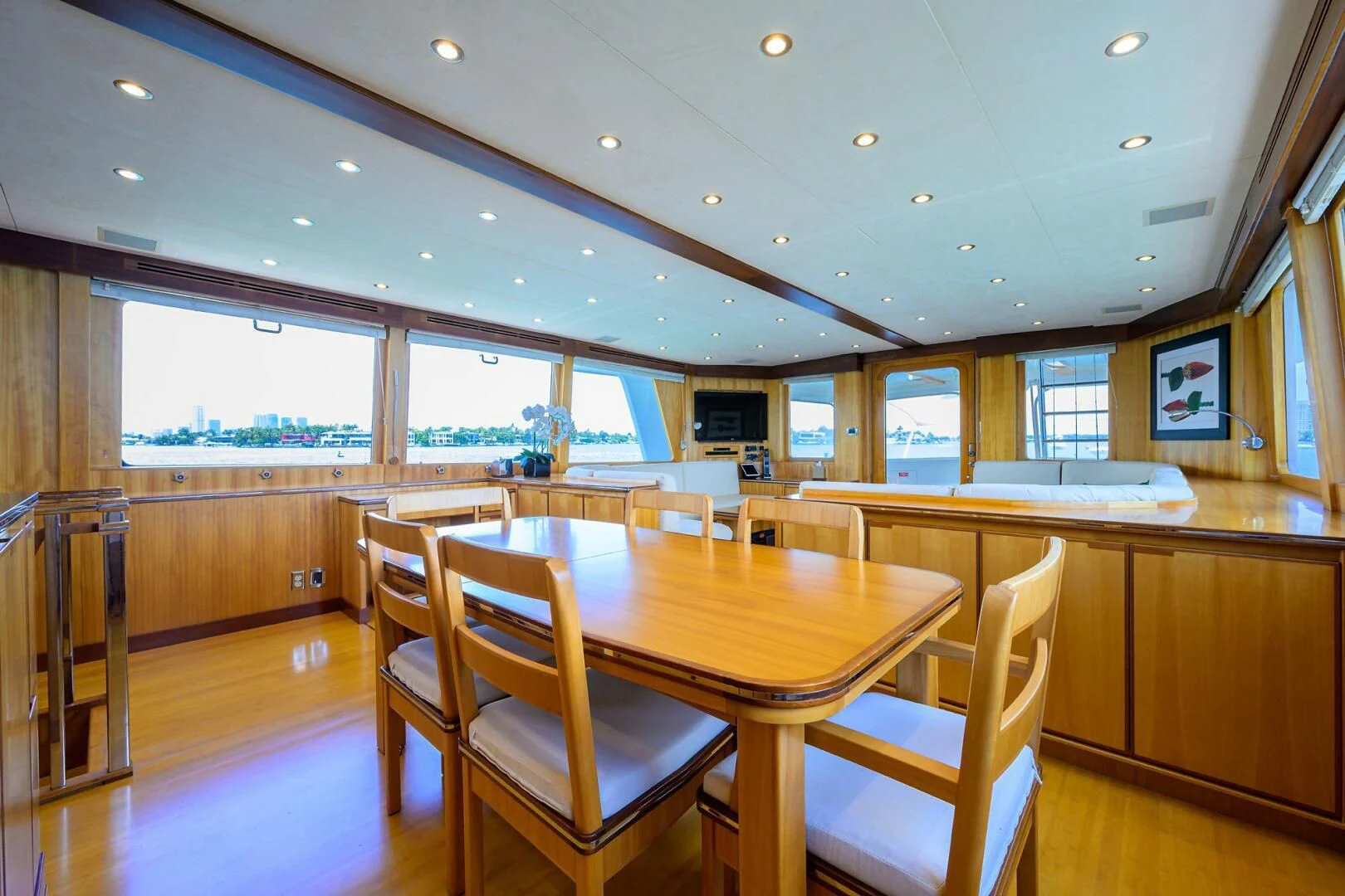a large room with tables and chairs aboard ELECTRA Yacht for Sale