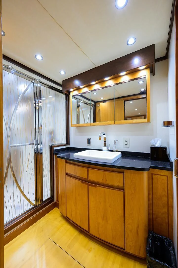 a bathroom with a sink and cabinets aboard ELECTRA Yacht for Sale