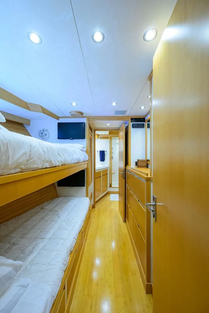 a room with a bed and a mirror aboard ELECTRA Yacht for Sale