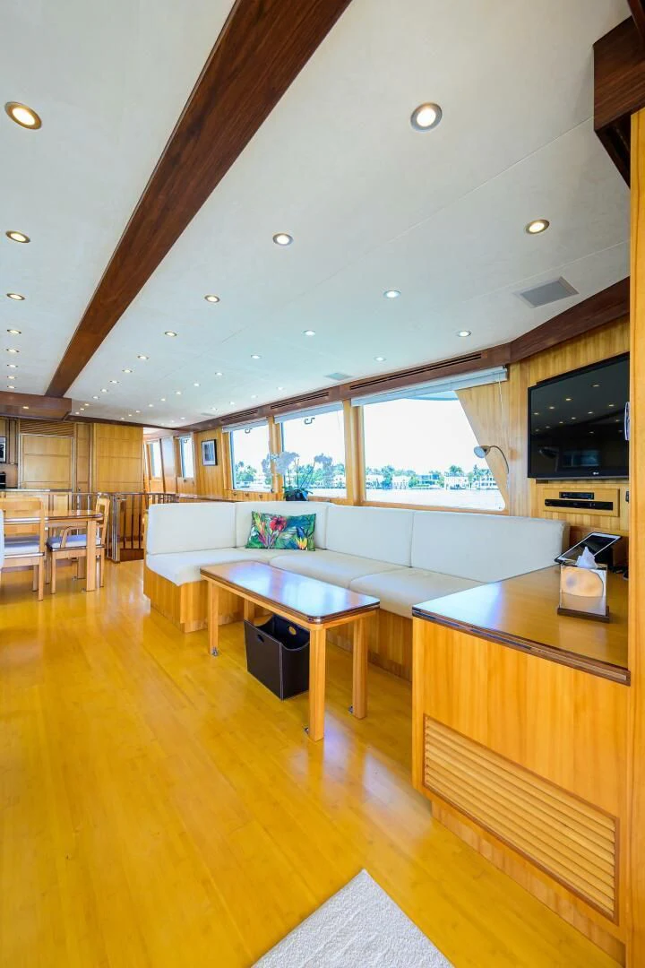 a large living room with a wood floor aboard ELECTRA Yacht for Sale