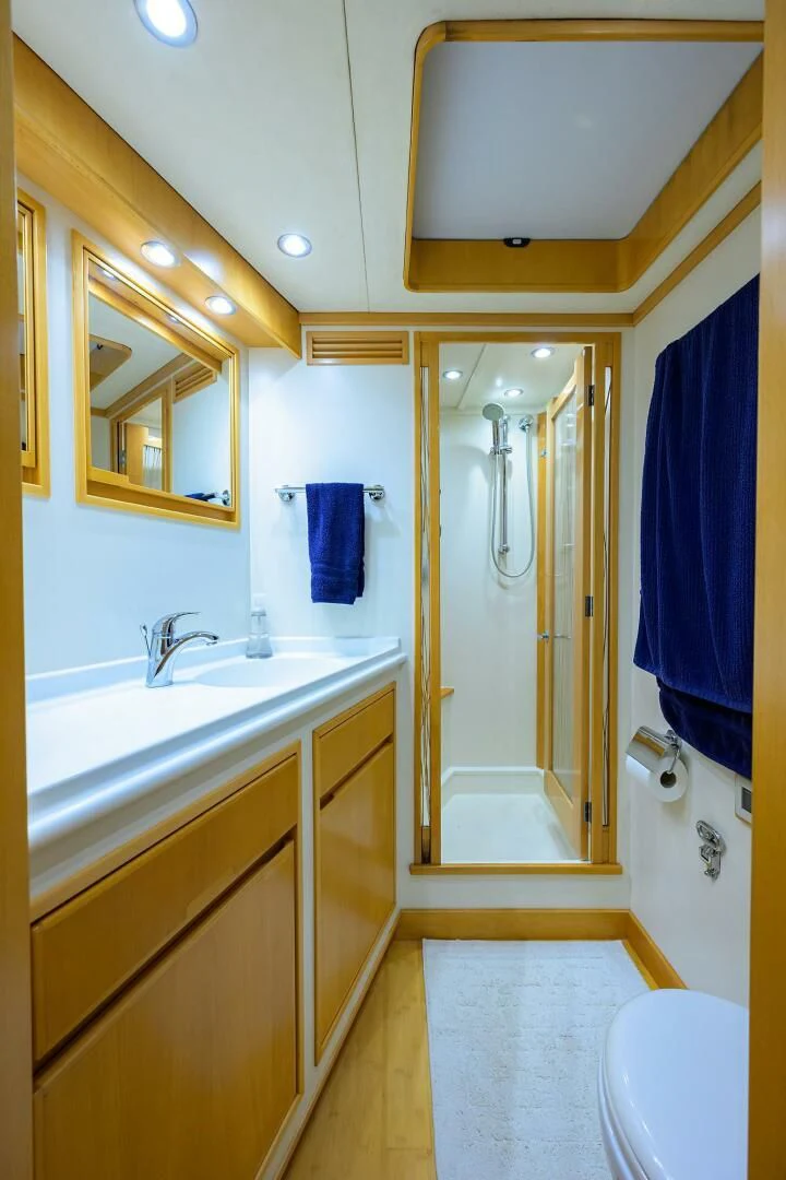 a bathroom with a shower and sink aboard ELECTRA Yacht for Sale