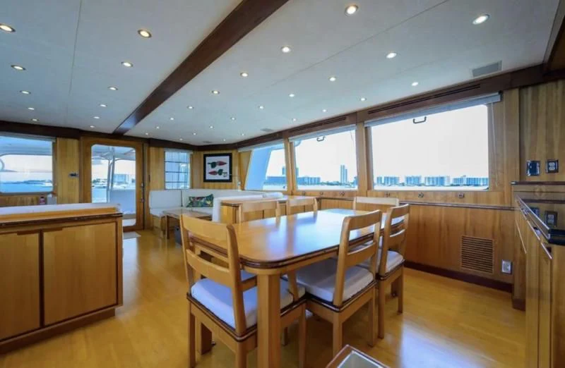 a kitchen and dining area aboard ELECTRA Yacht for Sale