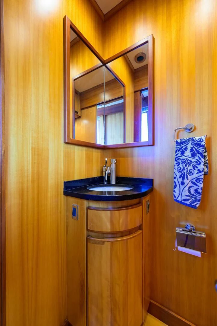 a bathroom with a sink and a mirror aboard ELECTRA Yacht for Sale