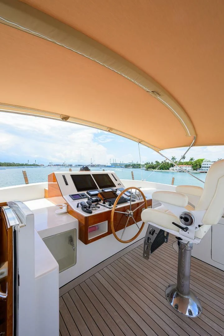 a table with a laptop on it aboard ELECTRA Yacht for Sale