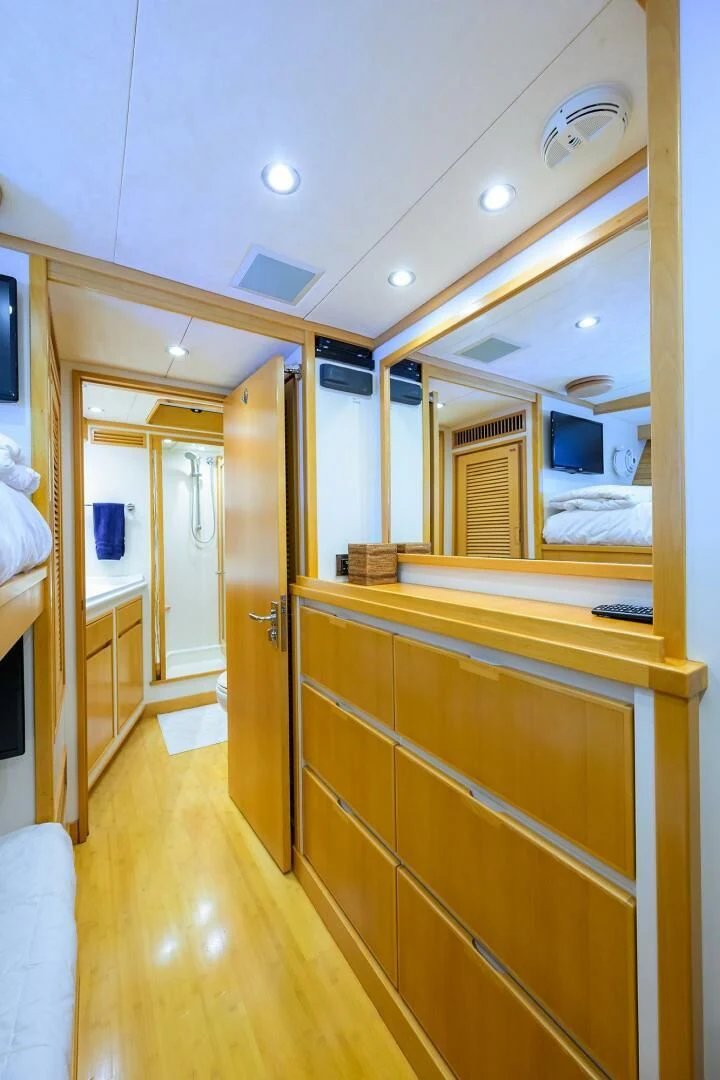 a room with a wood floor and a mirror aboard ELECTRA Yacht for Sale