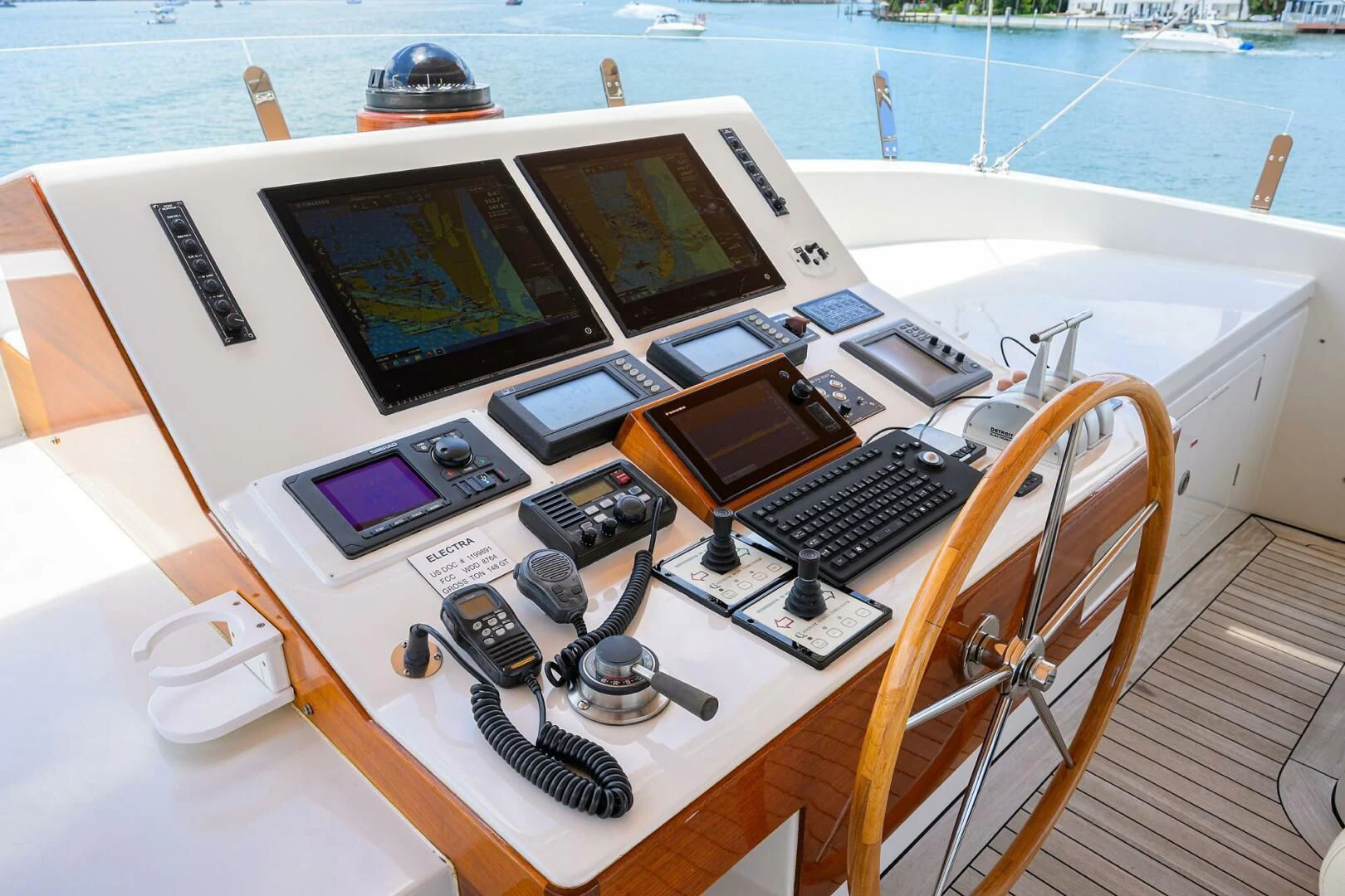 a table with laptops and headphones on it aboard ELECTRA Yacht for Sale