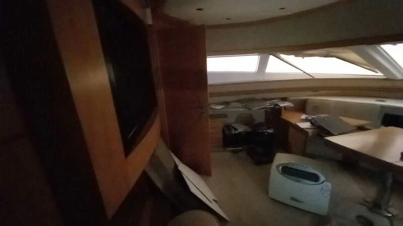 a room with a bed and desk aboard MY LADY ROSE Yacht for Sale