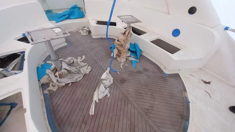 a white car with a blue and white car hood aboard MY LADY ROSE Yacht for Sale