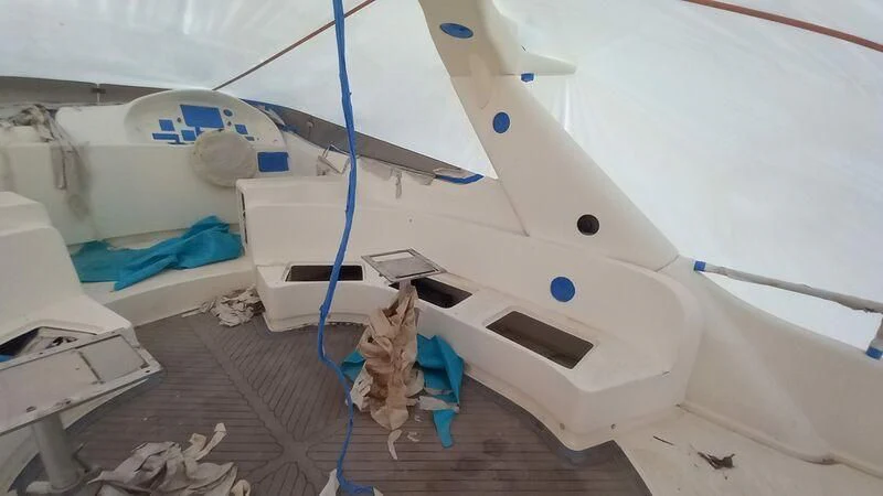 a white boat with blue and white paint aboard MY LADY ROSE Yacht for Sale
