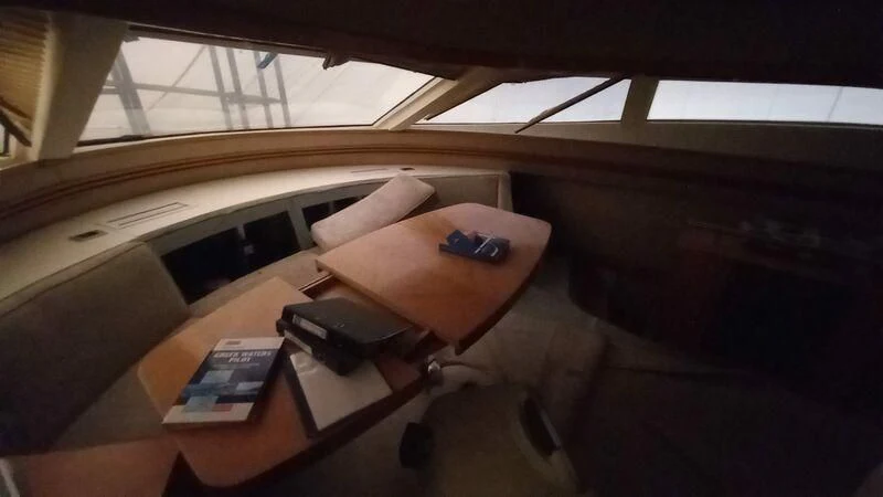 a table with a phone on it aboard MY LADY ROSE Yacht for Sale