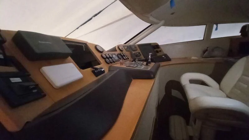 a desk with a computer and other electronics on it aboard MY LADY ROSE Yacht for Sale