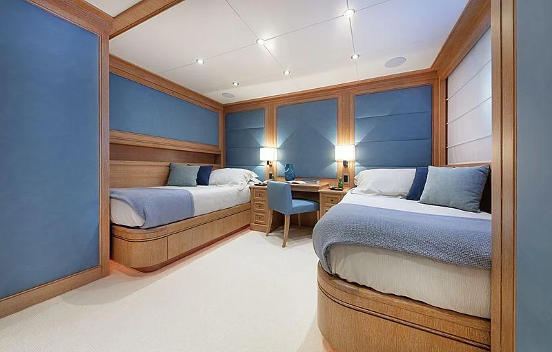 a room with two beds aboard THEOLINA Yacht for Sale