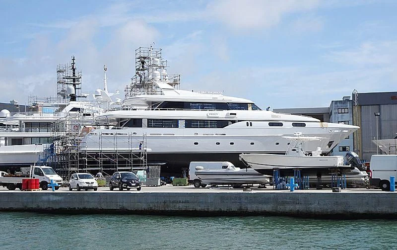 a large white ship docked aboard THEOLINA Yacht for Sale