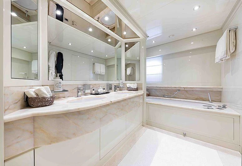 a bathroom with a large mirror aboard THEOLINA Yacht for Sale