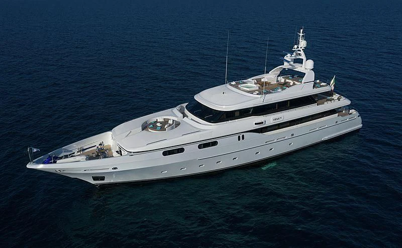 a white yacht in the ocean aboard THEOLINA Yacht for Sale