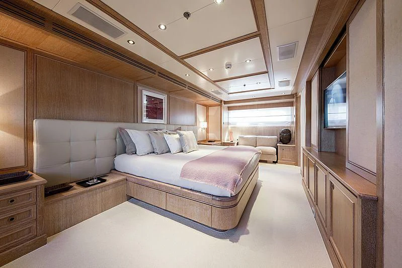 a large bedroom with a bed aboard THEOLINA Yacht for Sale