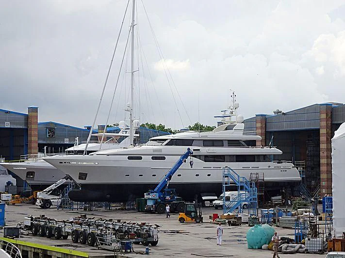 a large white ship docked aboard THEOLINA Yacht for Sale