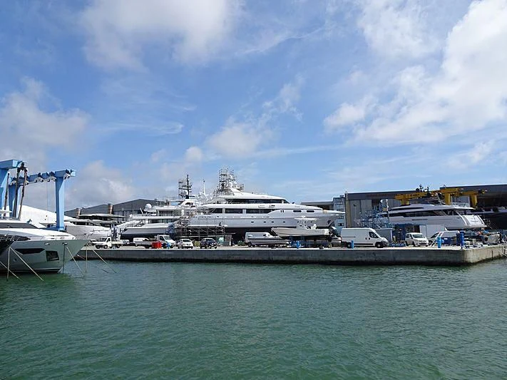 a large ship docked at a port aboard THEOLINA Yacht for Sale