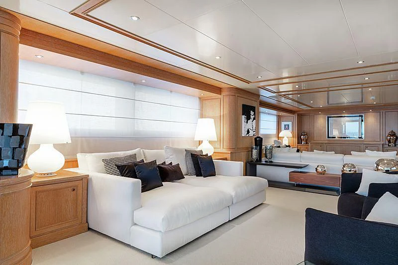 a large living room with a large bed and a large mirror aboard THEOLINA Yacht for Sale
