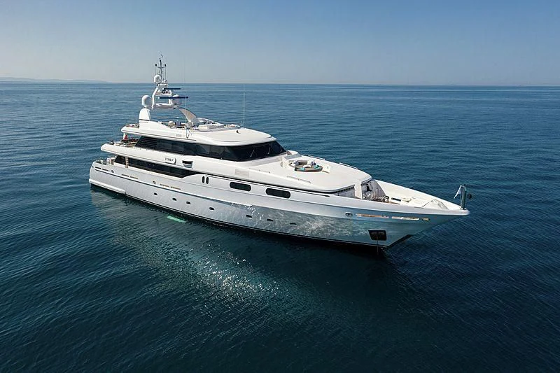 a white yacht in the water aboard THEOLINA Yacht for Sale