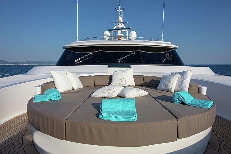 a bed with pillows on it aboard THEOLINA Yacht for Sale