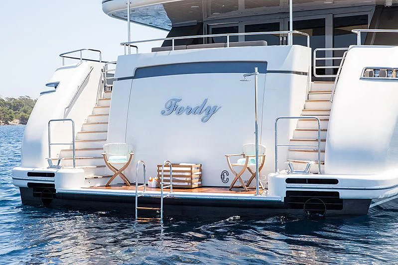 a white boat with a ladder on the deck aboard THEOLINA Yacht for Sale