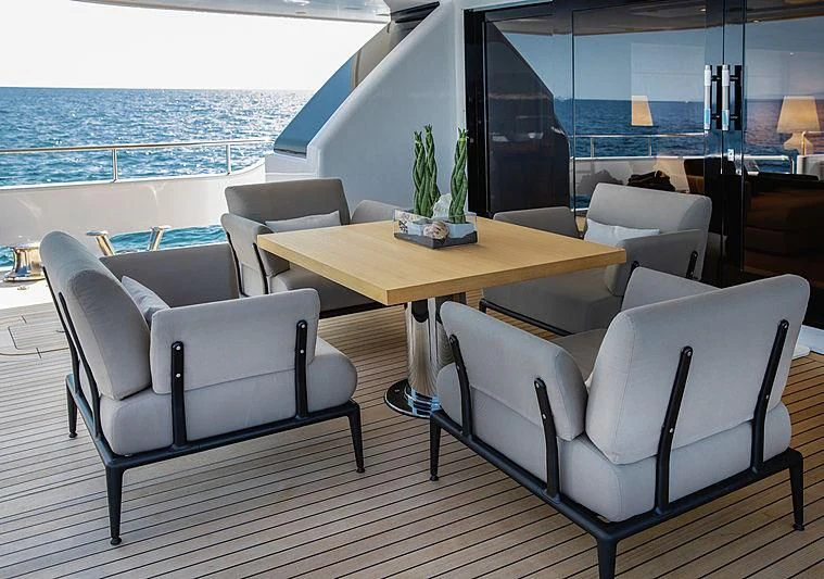 a room with a table and chairs aboard THEOLINA Yacht for Sale