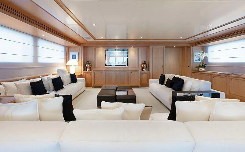 a living room with white couches aboard THEOLINA Yacht for Sale