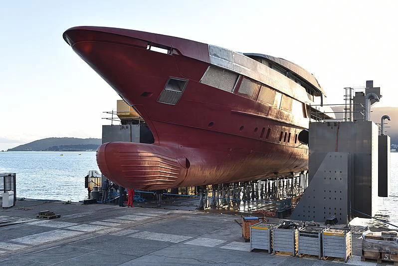 a large red airplane aboard AILY Yacht for Sale