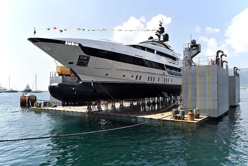 a large cruise ship docked aboard AILY Yacht for Sale