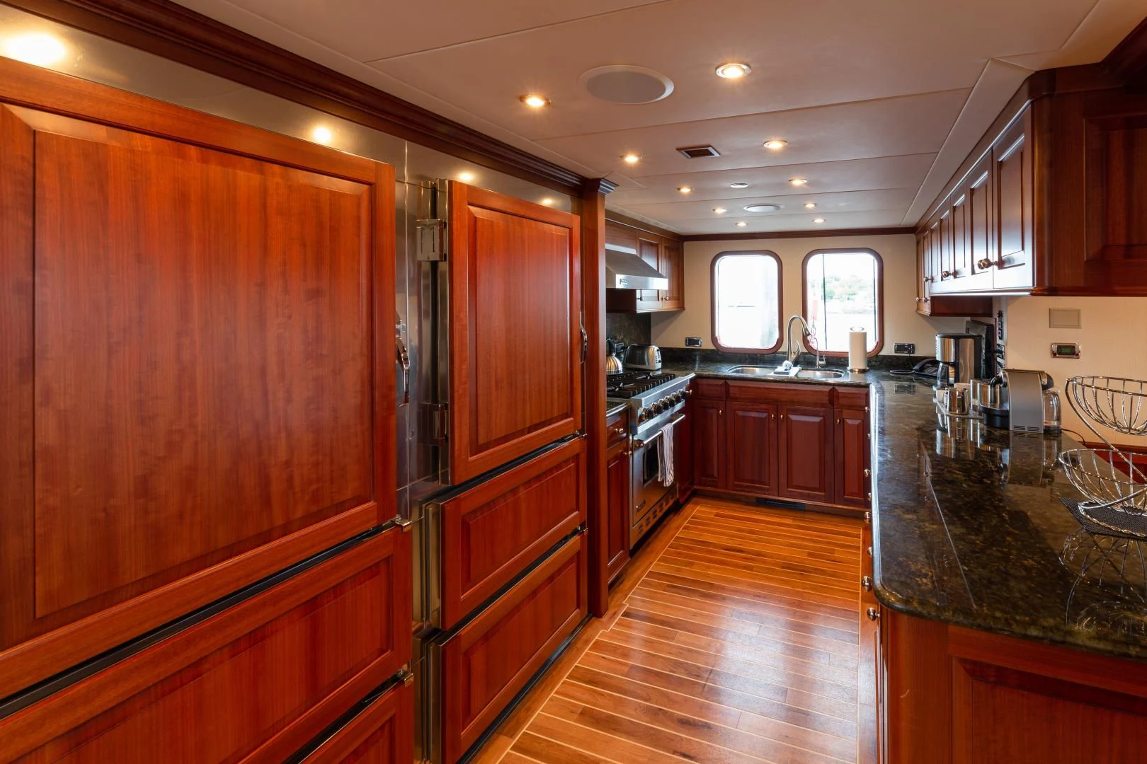 a kitchen with wooden cabinets aboard ISLANDER Yacht for Sale