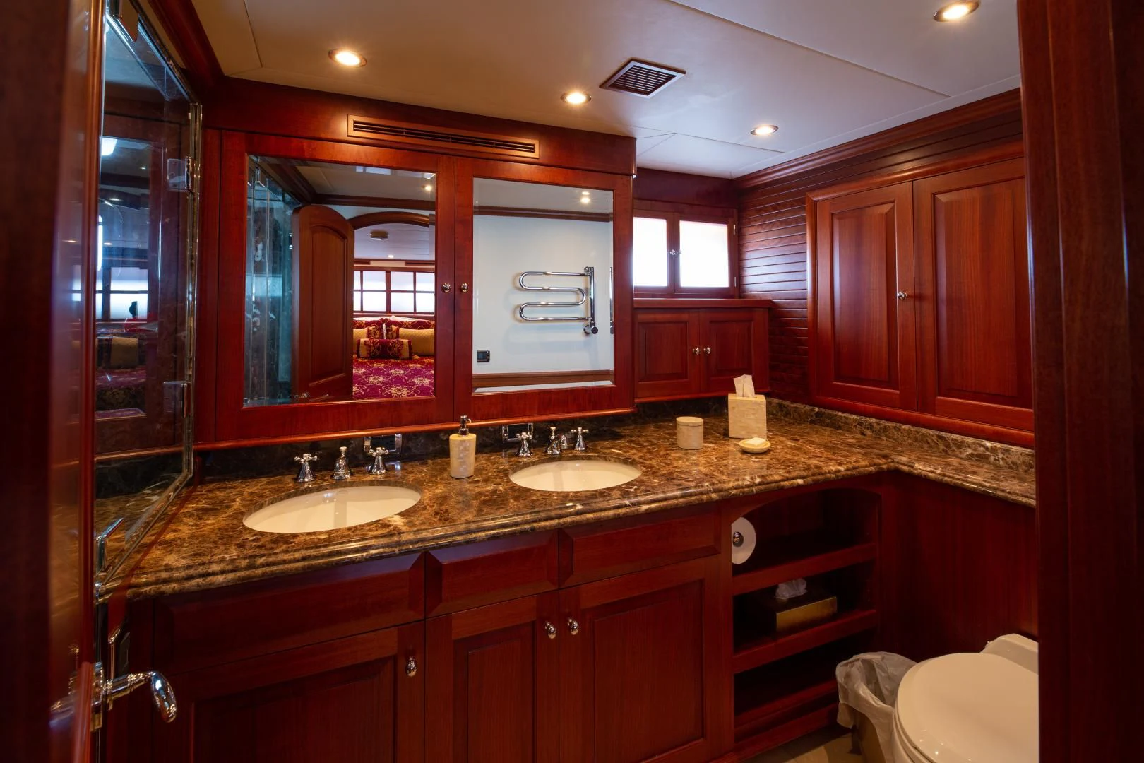 a bathroom with a countertop sink and mirrors aboard ISLANDER Yacht for Sale