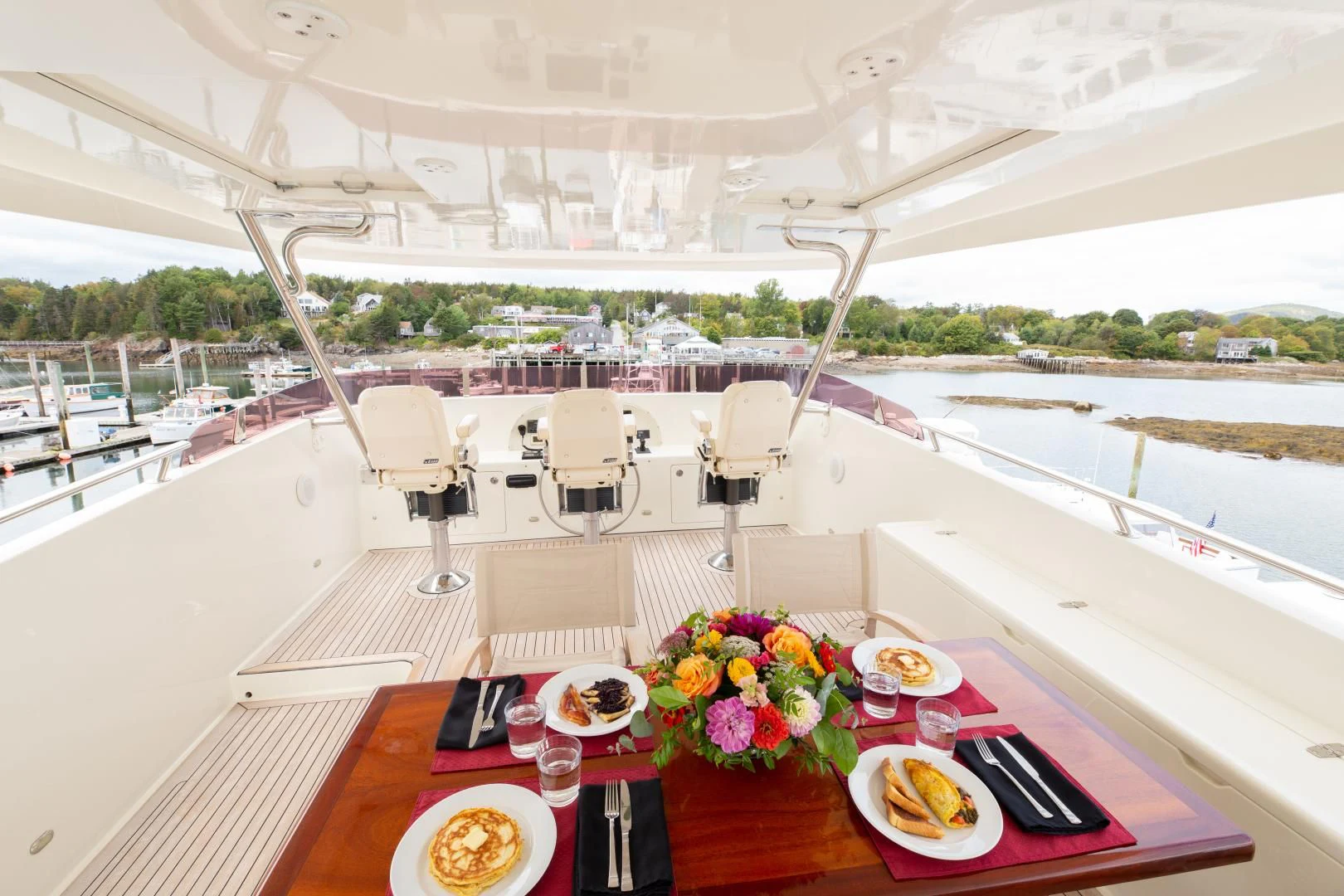 a table with plates and food on it aboard ISLANDER Yacht for Sale