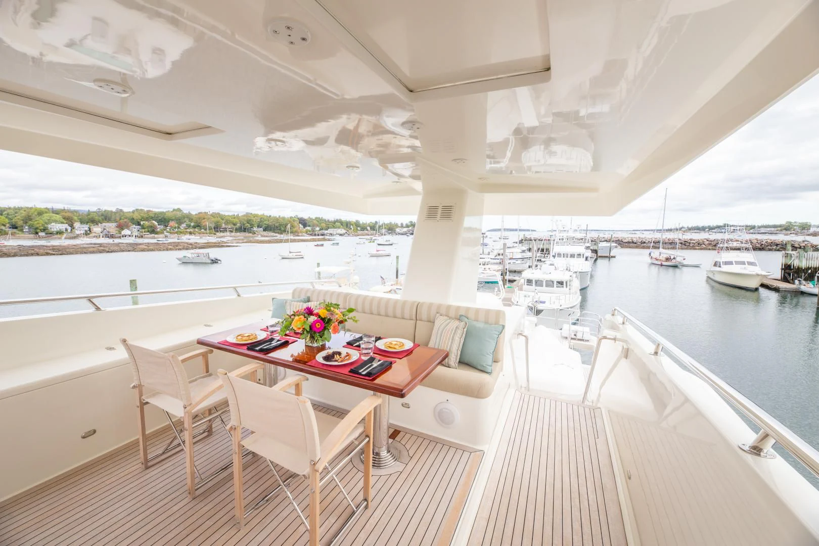 a table and chairs on a deck aboard ISLANDER Yacht for Sale