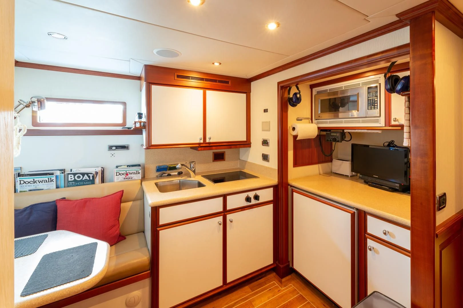 a small kitchen with a bed aboard ISLANDER Yacht for Sale