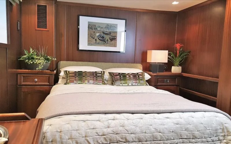 a bed with a white sheet aboard TRAFALGAR Yacht for Sale