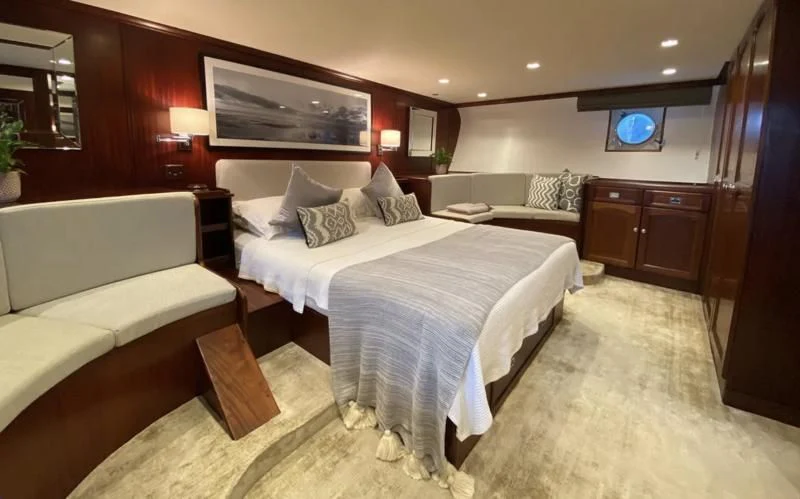 a room with a couple of beds aboard TRAFALGAR Yacht for Sale