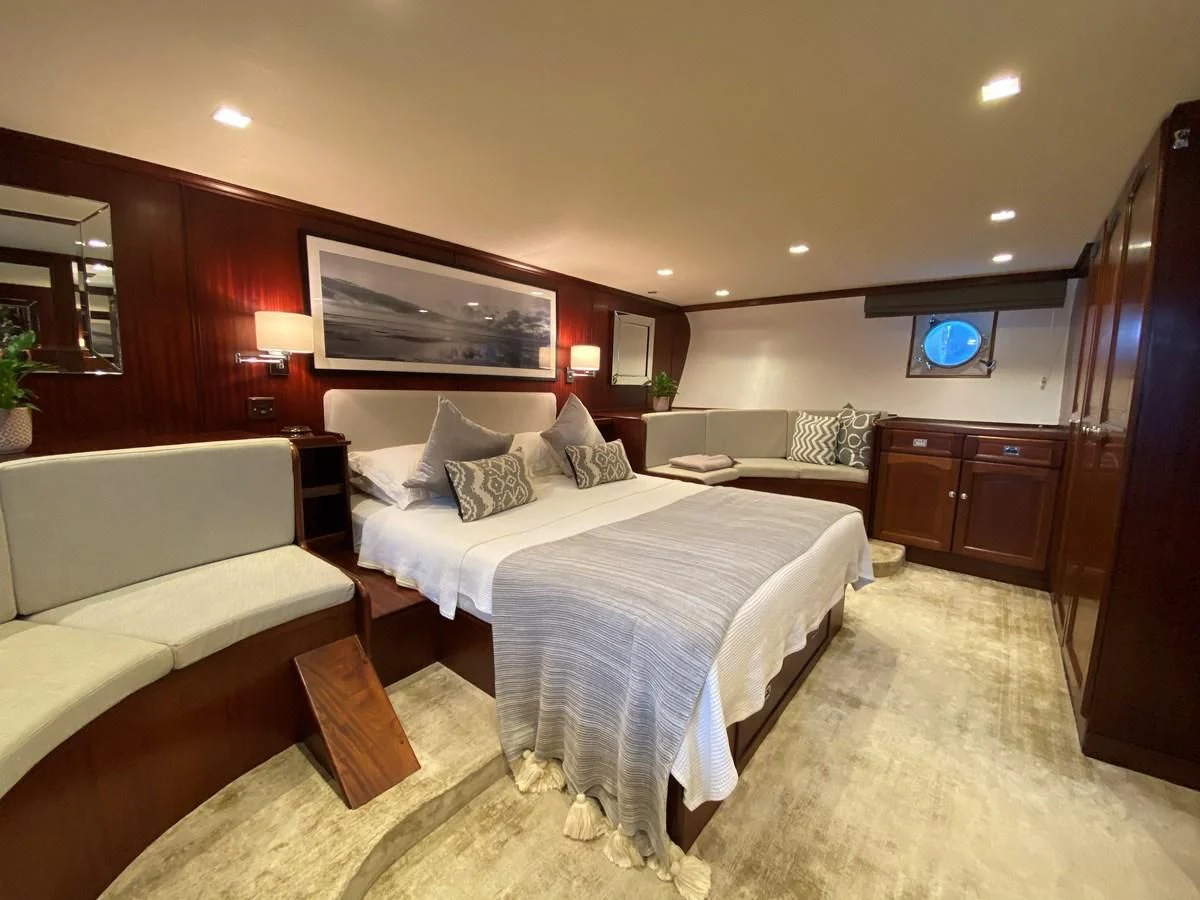 a hotel room with a couple of beds aboard TRAFALGAR Yacht for Sale