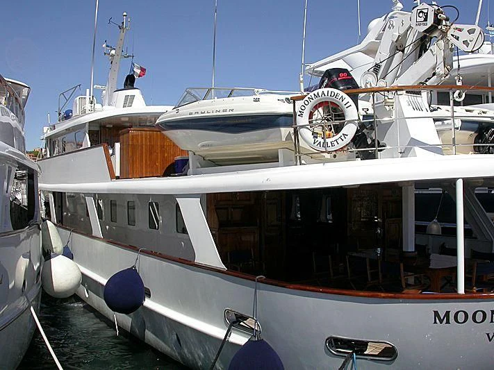 a boat with a clock on the front aboard TRAFALGAR Yacht for Sale