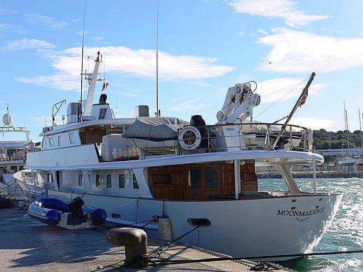 a boat docked at a pier aboard TRAFALGAR Yacht for Sale