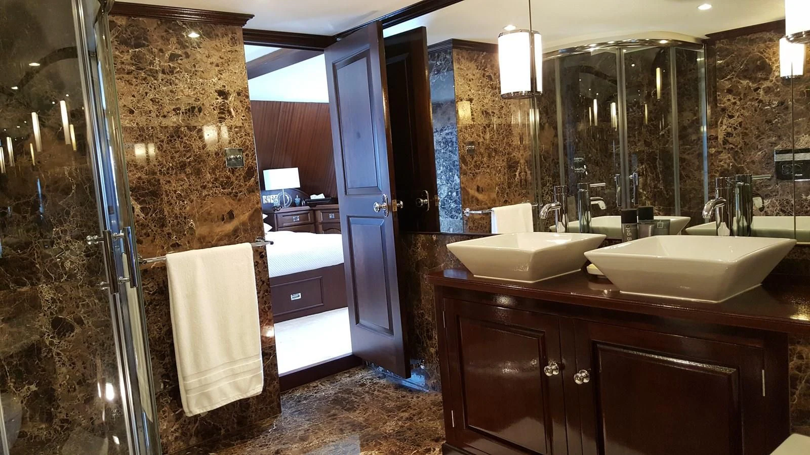 a bathroom with a sink and a shower aboard TRAFALGAR Yacht for Sale