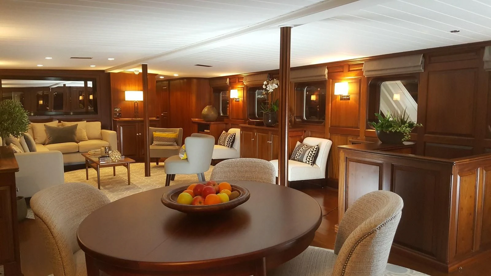 a room with a table and chairs aboard TRAFALGAR Yacht for Sale