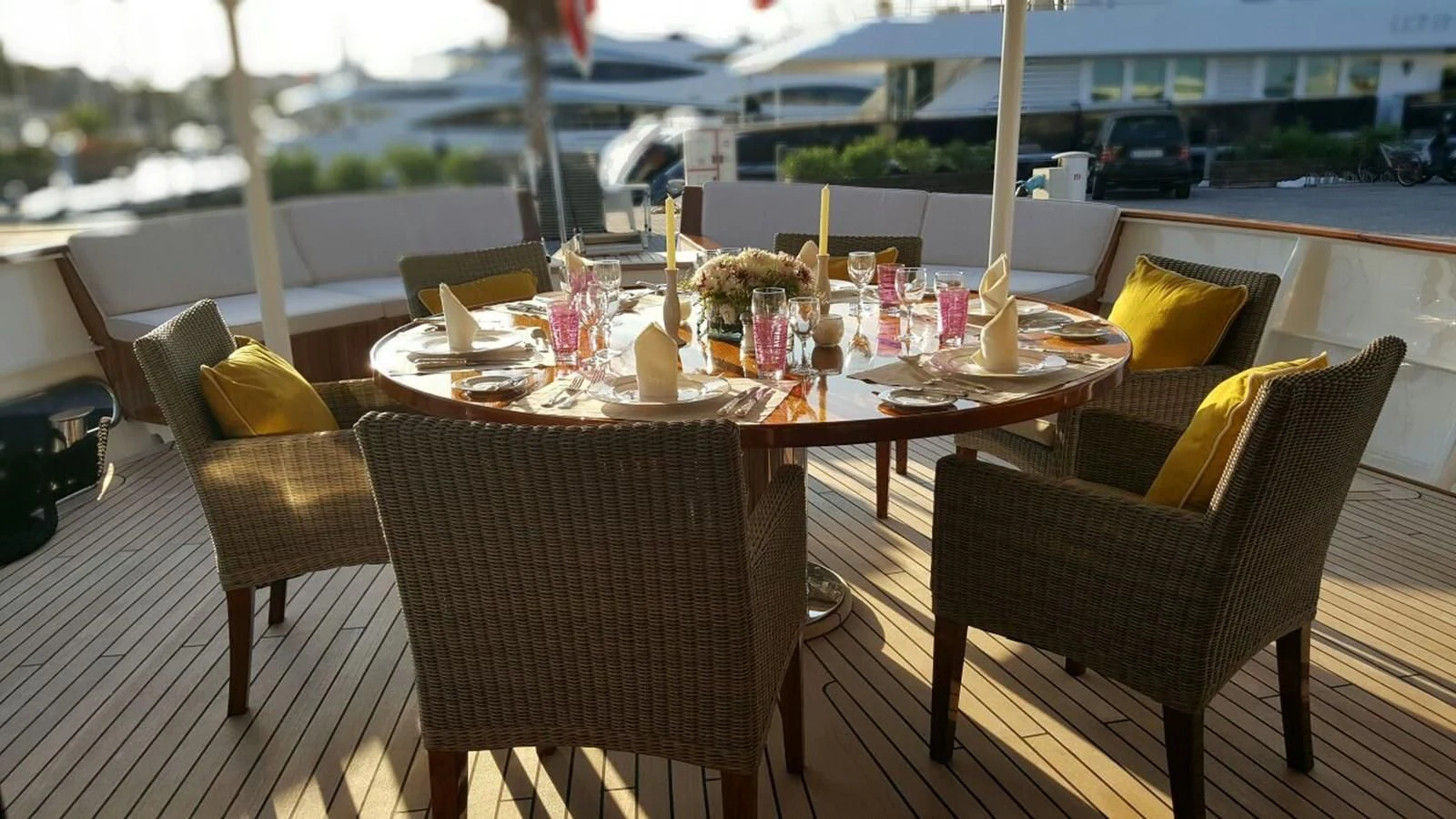 a table with chairs and a couple of chairs on it aboard TRAFALGAR Yacht for Sale