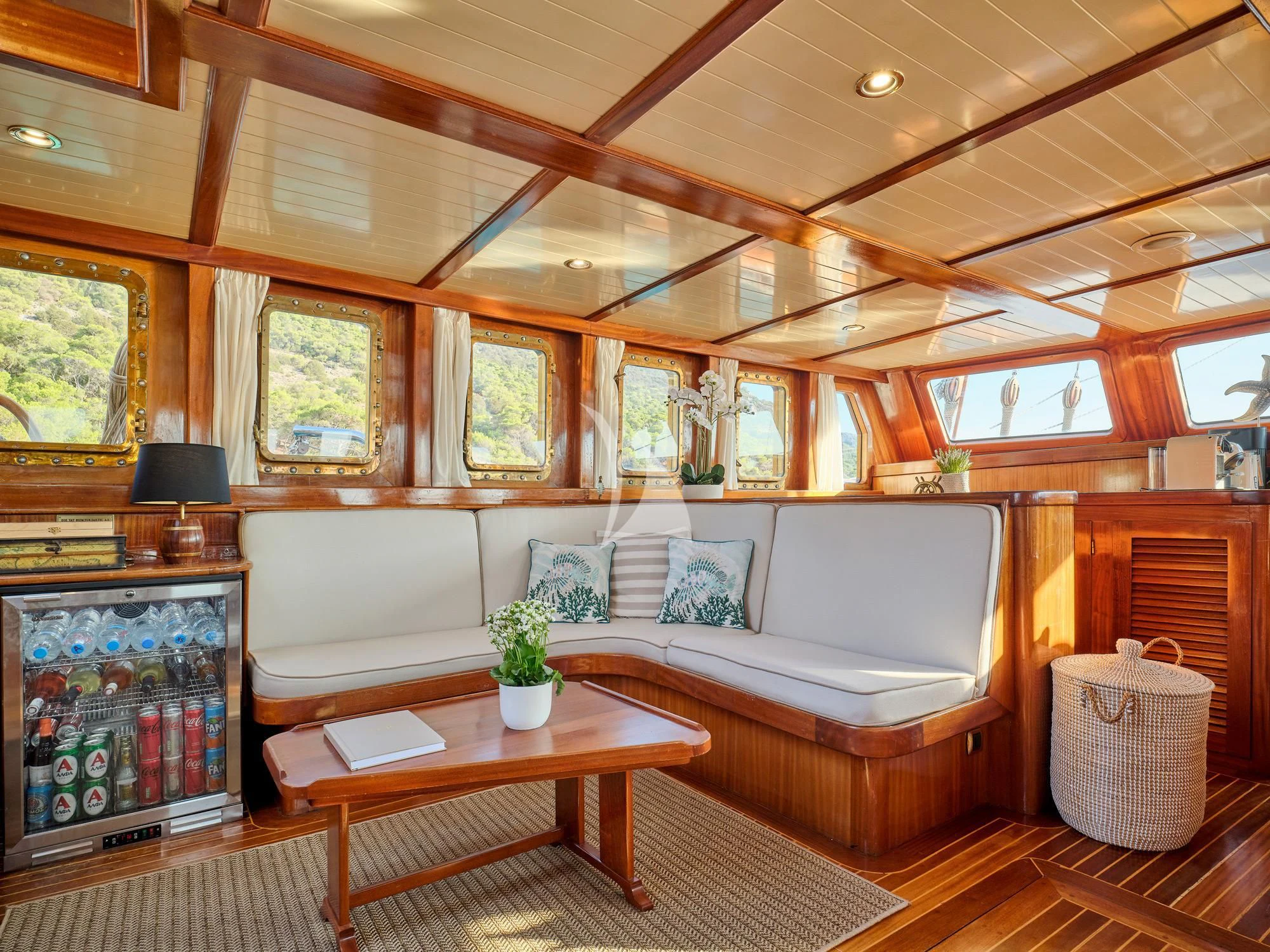 a room with a couch and a table aboard MYRA Yacht for Sale