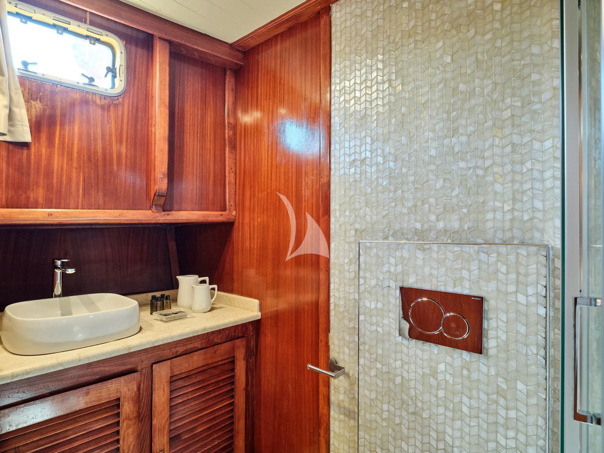 a bathroom with a sink and a mirror aboard MYRA Yacht for Sale