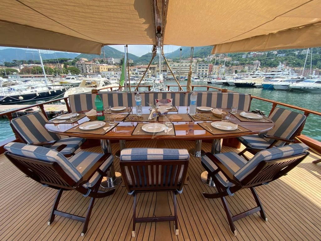 a table set for a meal aboard MYRA Yacht for Sale