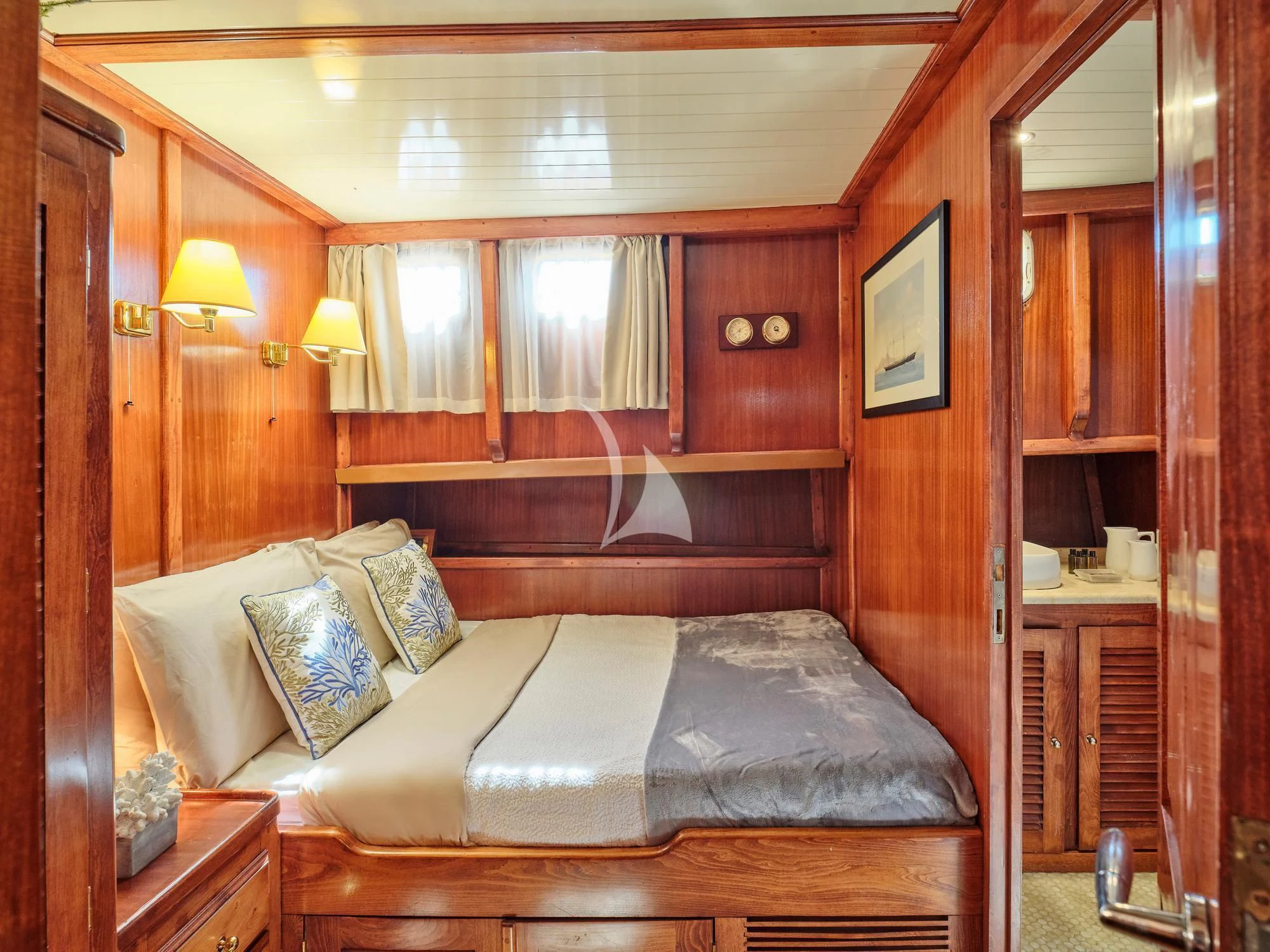 a bed in a room aboard MYRA Yacht for Sale